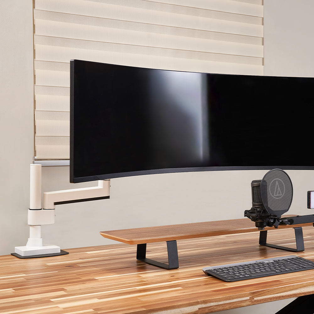 ULTRARM monitor arm and Moodular wooden monitor stand — modular, ergonomic, and designed for VISION ultrawide monitors. Enhances comfort, saves space, and elevates your workspace with precision craftsmanship.
